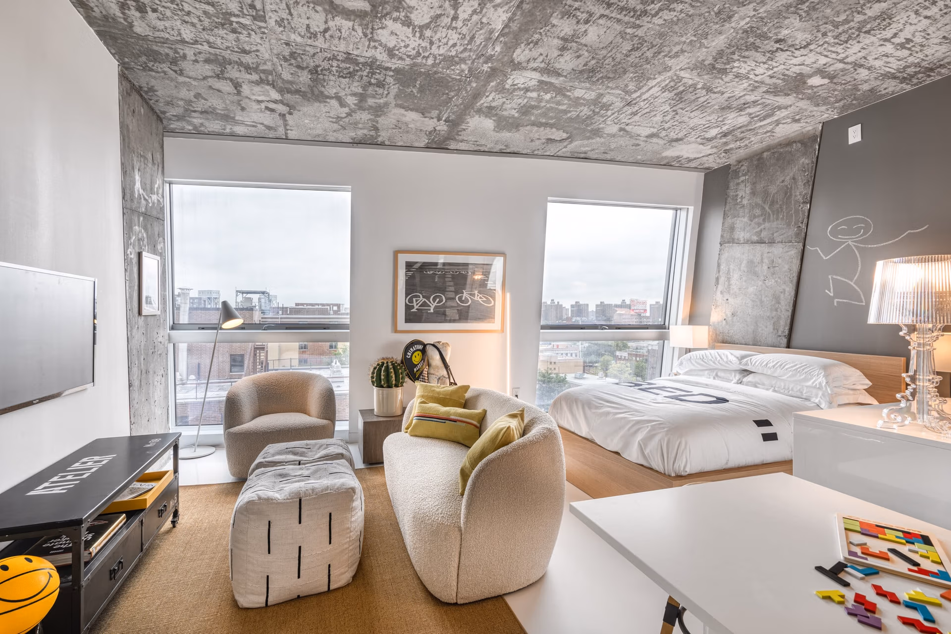 Separate bedroom and living room in a furnished apartment for work or recovery routines.