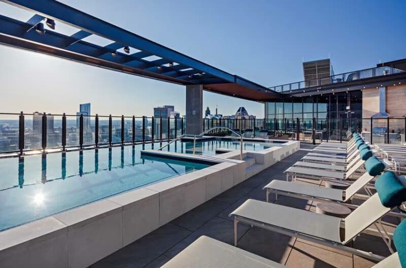 Rooftop pool and sundeck shown in a Hyatus Baltimore apartment listing