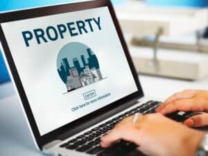 Laptop with property website homepage.
