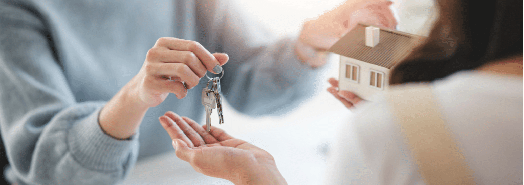 Handover of house keys to new tenant.