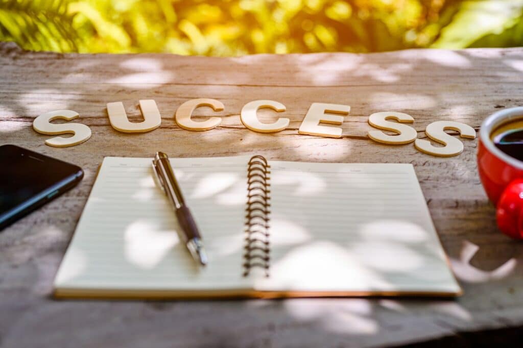 Success letters on notebook