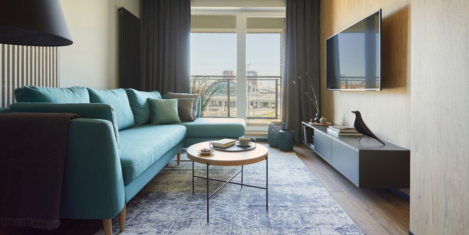 Creative composition of modern living room interior in small apartment.