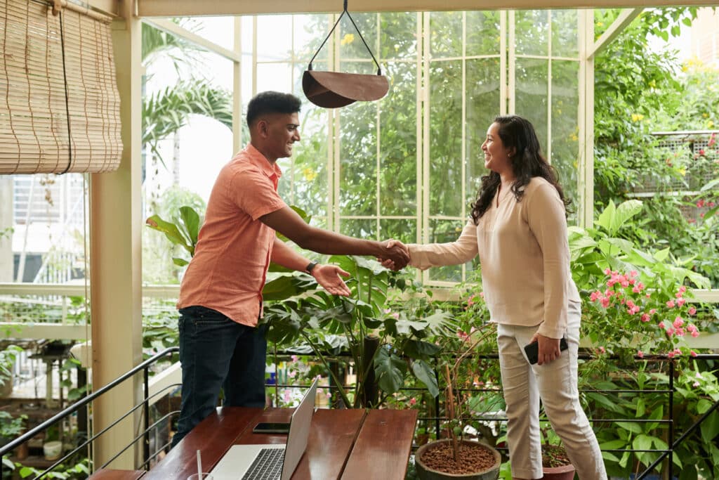 Friendly meeting in a bright, plant-filled rental space