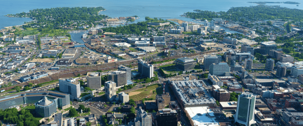 Aerial view of Stamford, Connecticut, showing the city skyline, waterfront, and downtown area.